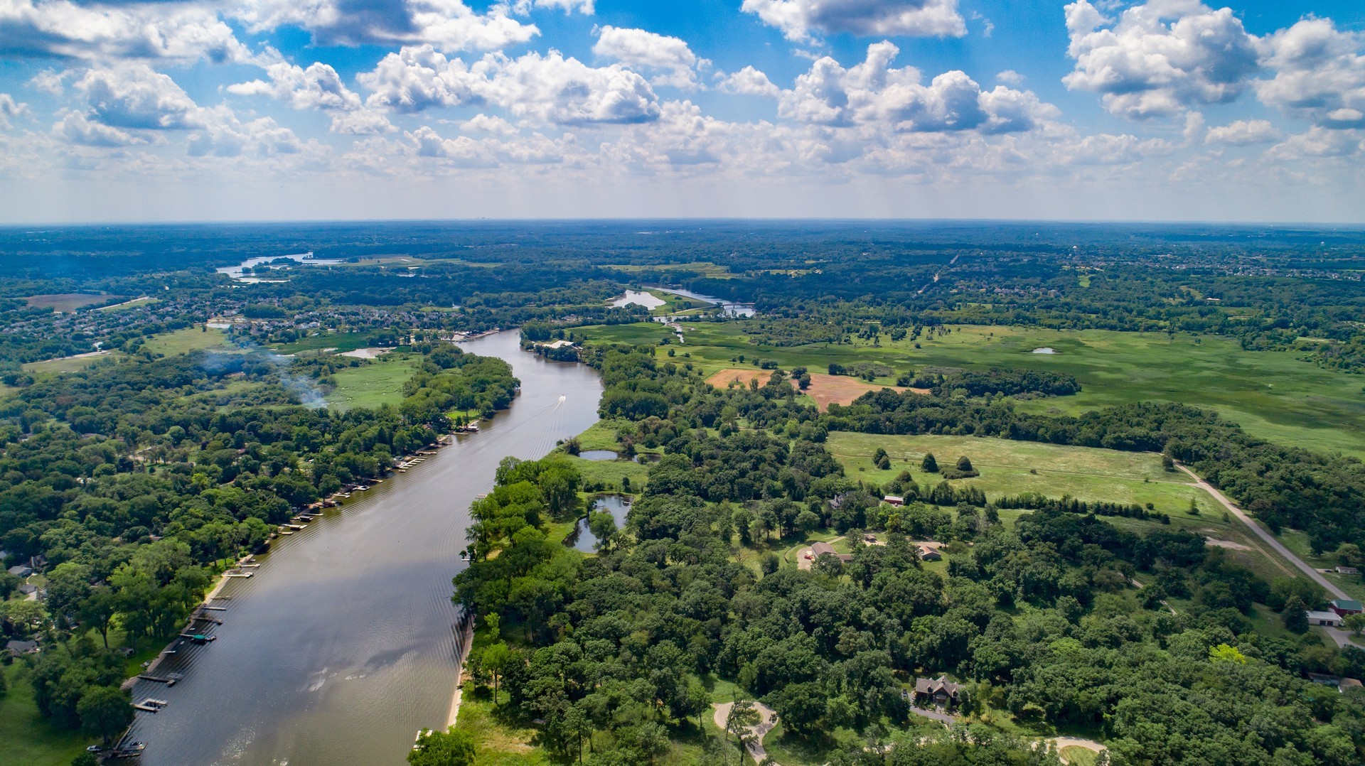 4444 Riverside Drive Crystal Lake, IL 60014 - Photo 30 of 30 an aerial view of residential houses with outdoor space and trees