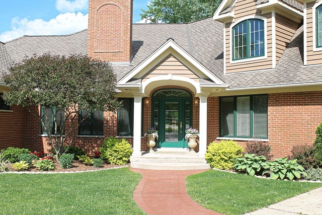 4444 Riverside Drive Crystal Lake, IL 60014 - Photo 4 of 30 a front view of a house with a yard