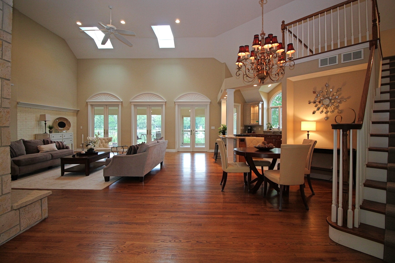 4444 Riverside Drive Crystal Lake, IL 60014 - Photo 5 of 30 a living room with fireplace furniture and a chandelier