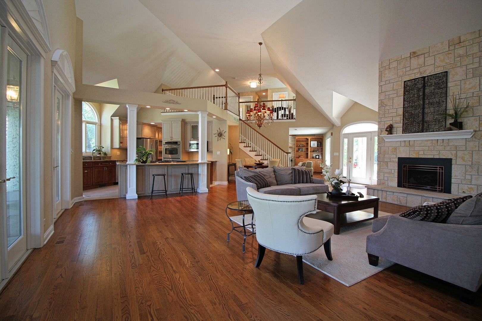 4444 Riverside Drive Crystal Lake, IL 60014 - Photo 6 of 30 a living room with furniture dining table wooden floor and a fireplace