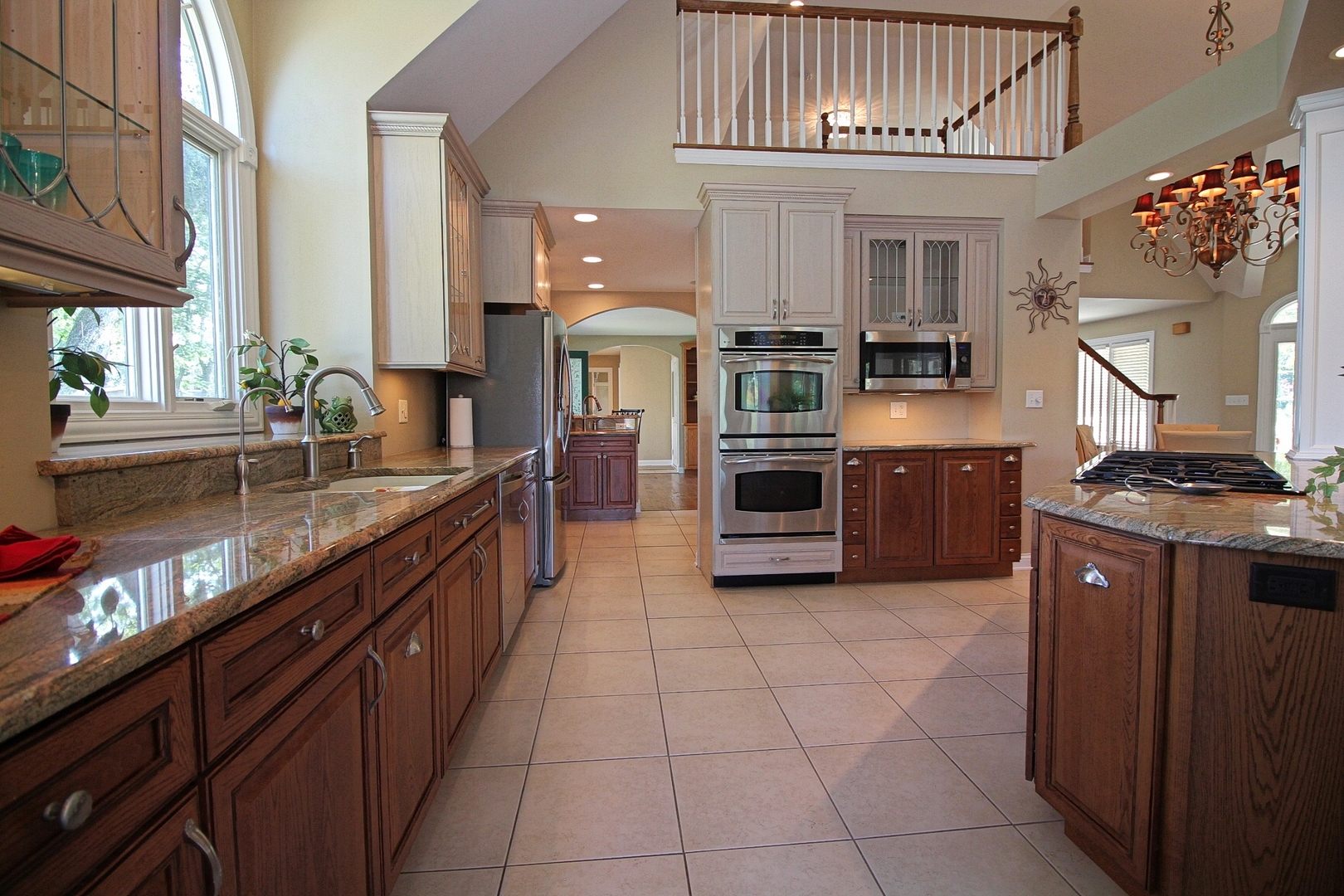 4444 Riverside Drive Crystal Lake, IL 60014 - Photo 7 of 30 a large kitchen with stainless steel appliances granite countertop a sink and cabinets