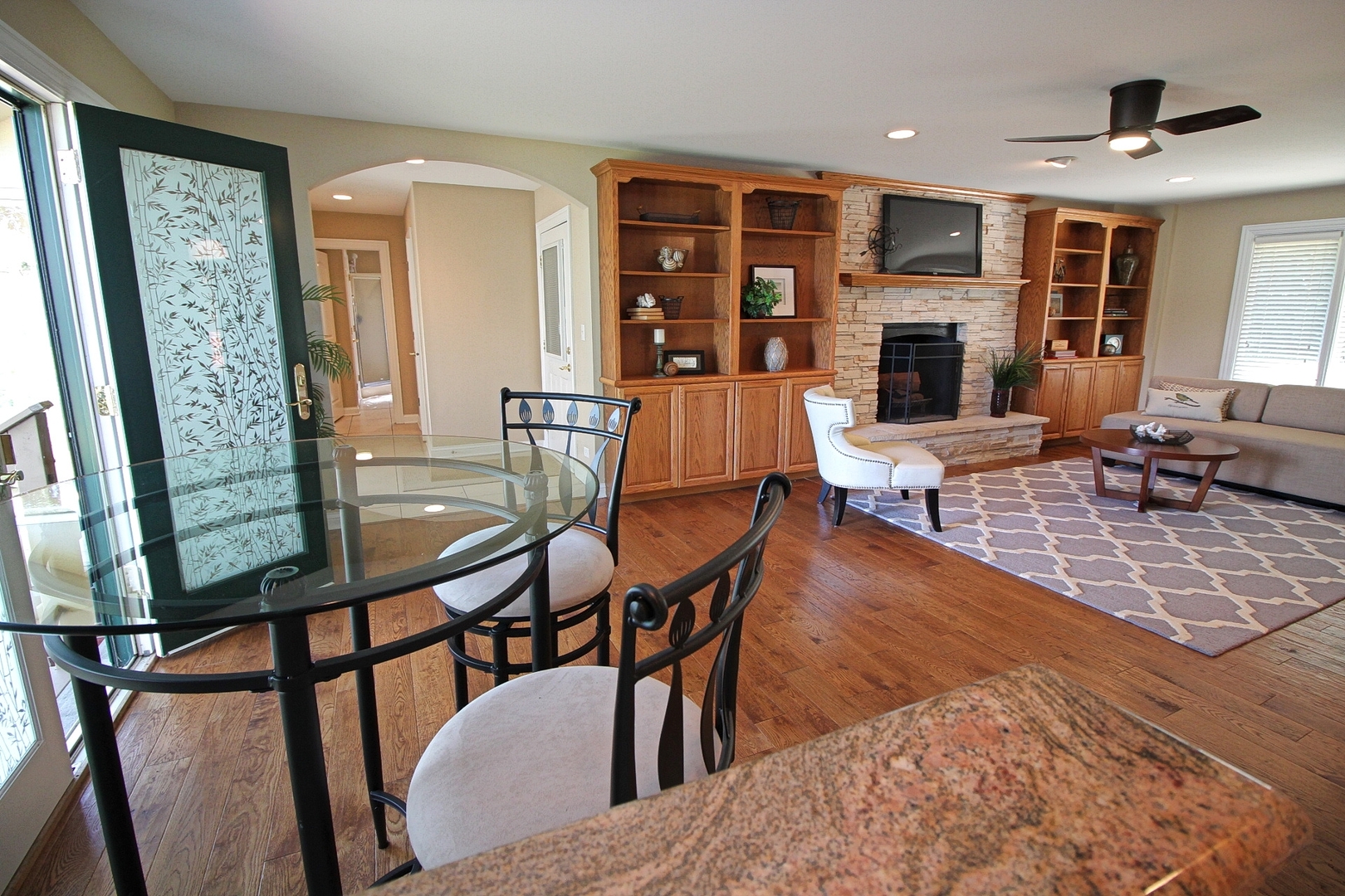 4444 Riverside Drive Crystal Lake, IL 60014 - Photo 10 of 30 a living room with fireplace furniture and a flat screen tv