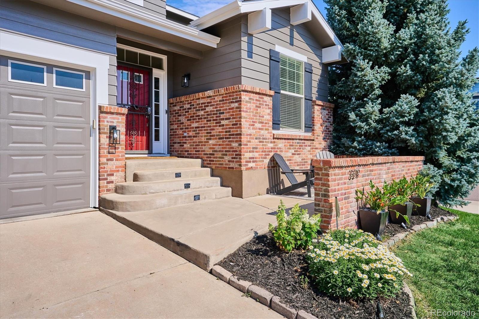 3319 Lynwood Avenue Highlands Ranch, CO 80126 - Photo 2 of 46 front view of a house with a yard