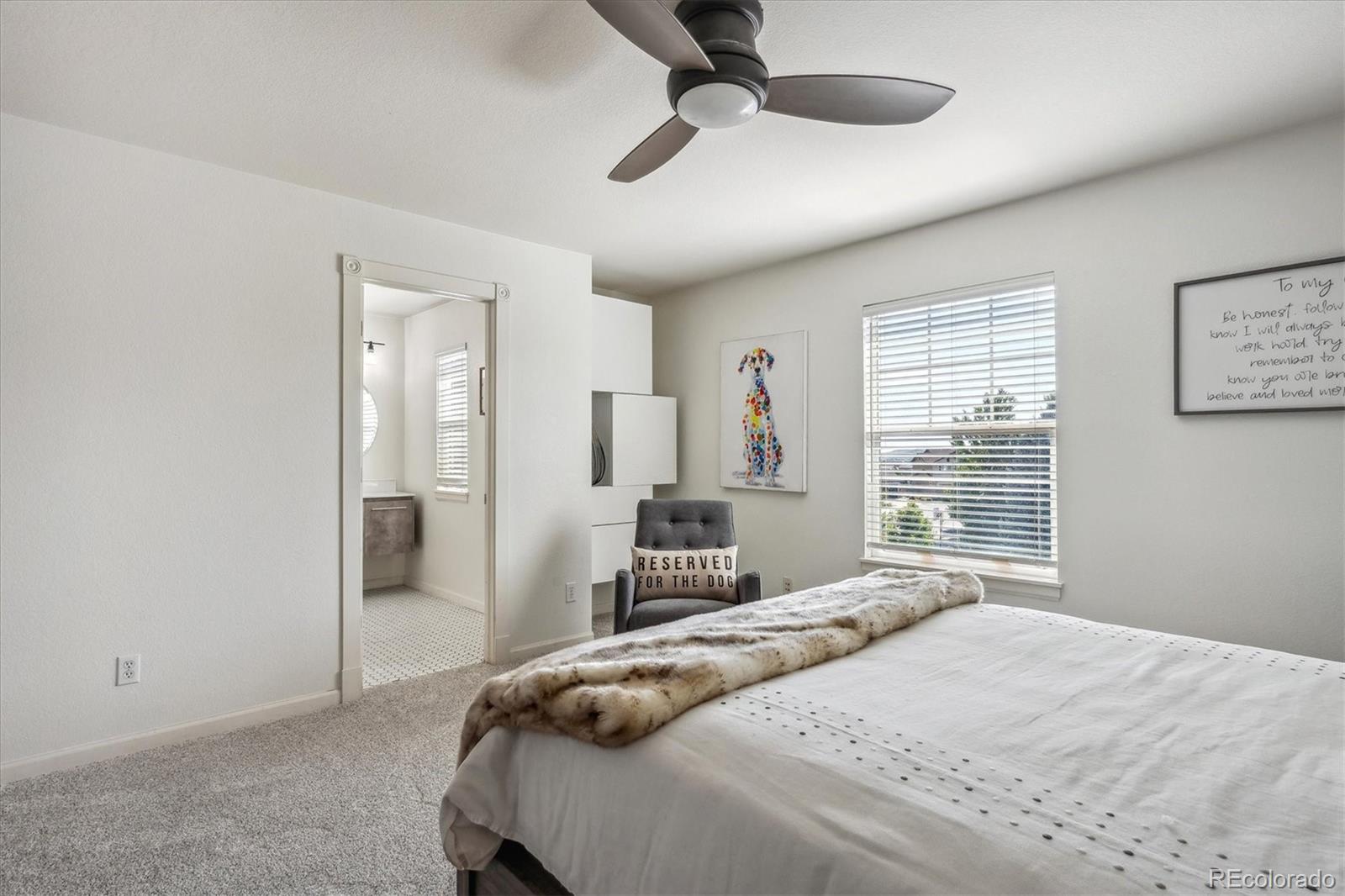 3319 Lynwood Avenue Highlands Ranch, CO 80126 - Photo 26 of 46 a bedroom with a bed and a chandelier