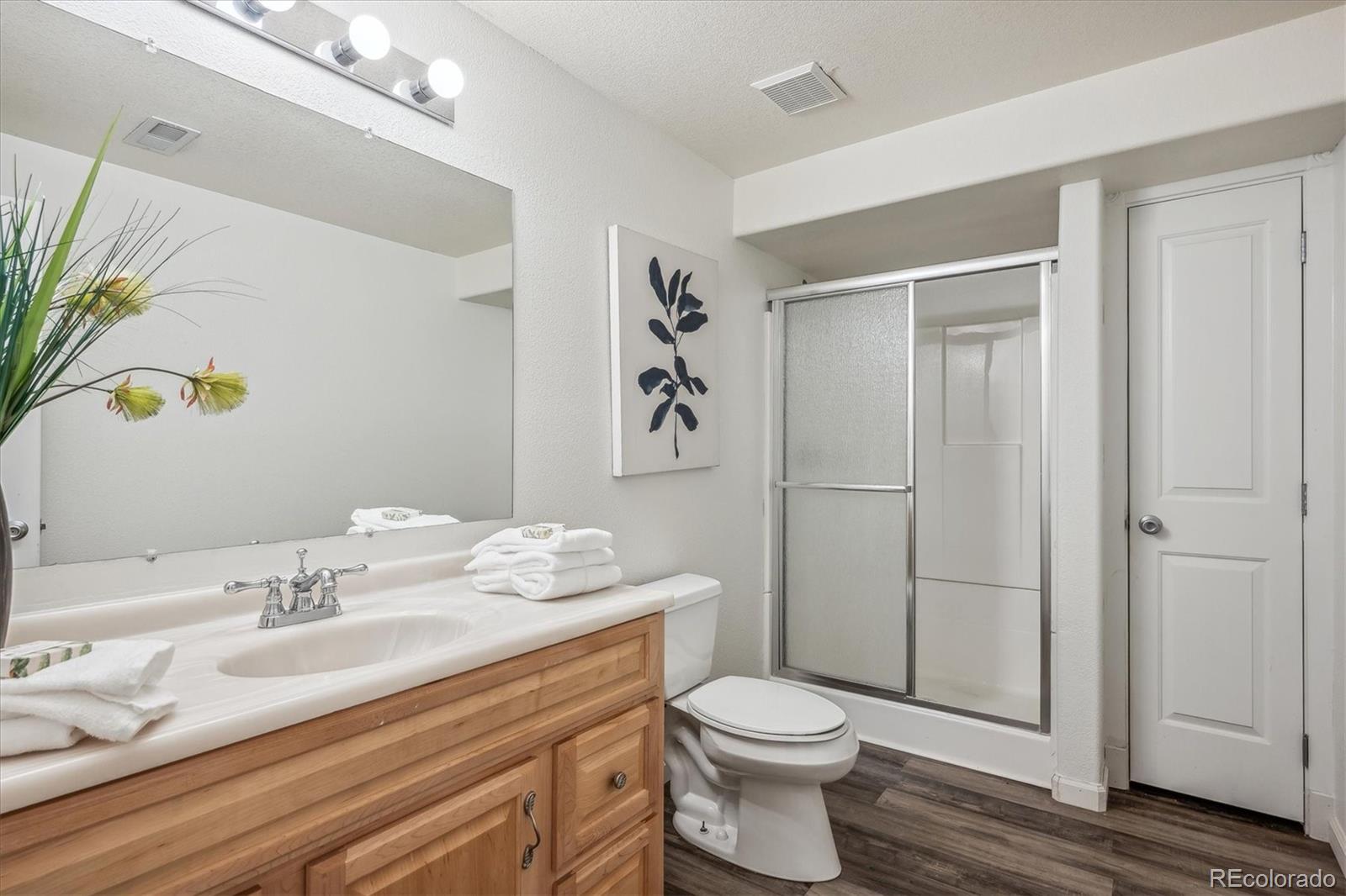 3319 Lynwood Avenue Highlands Ranch, CO 80126 - Photo 35 of 46 a bathroom with a sink a toilet and shower
