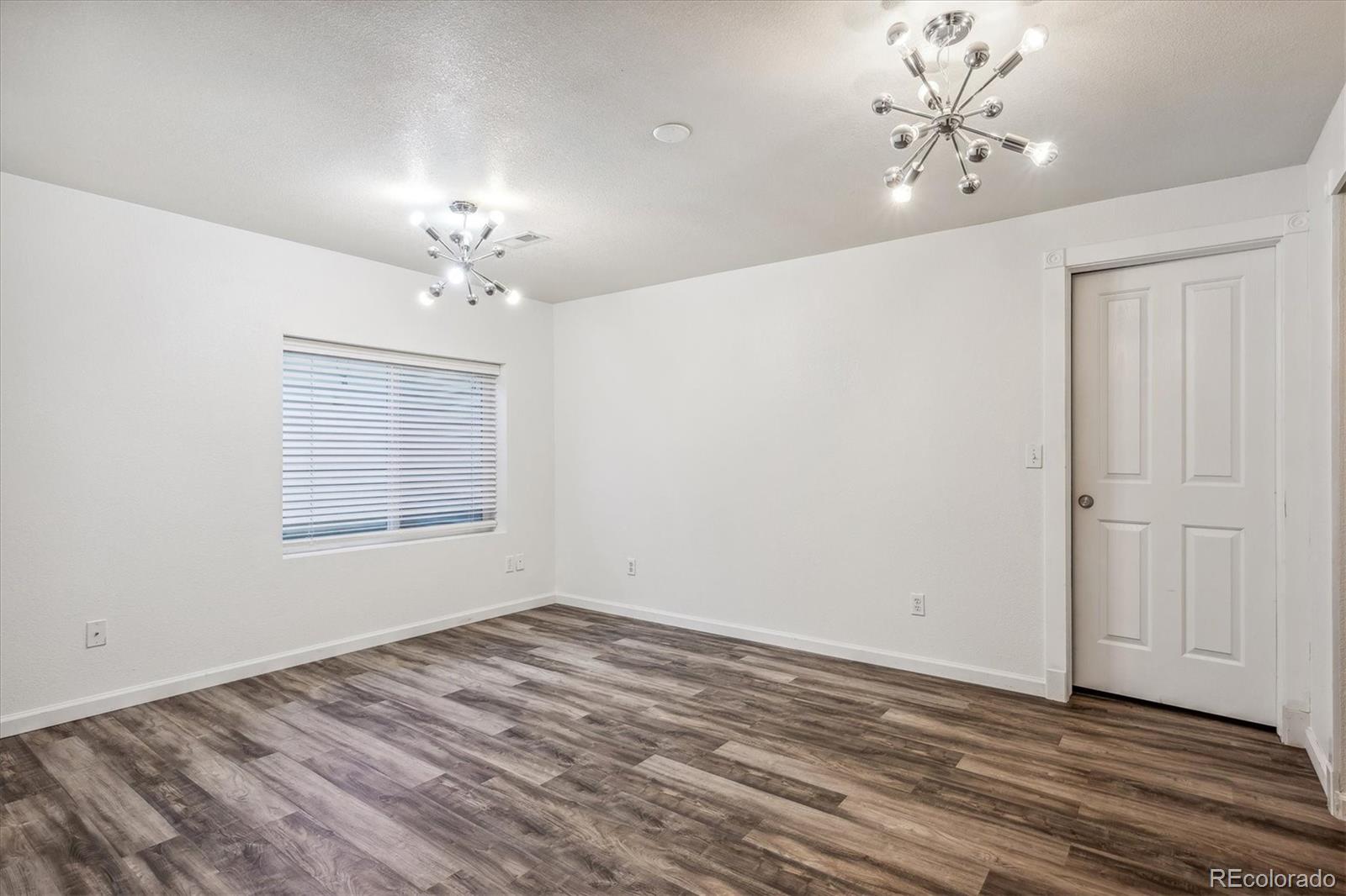 3319 Lynwood Avenue Highlands Ranch, CO 80126 - Photo 36 of 46 wooden floor in an empty room with a window