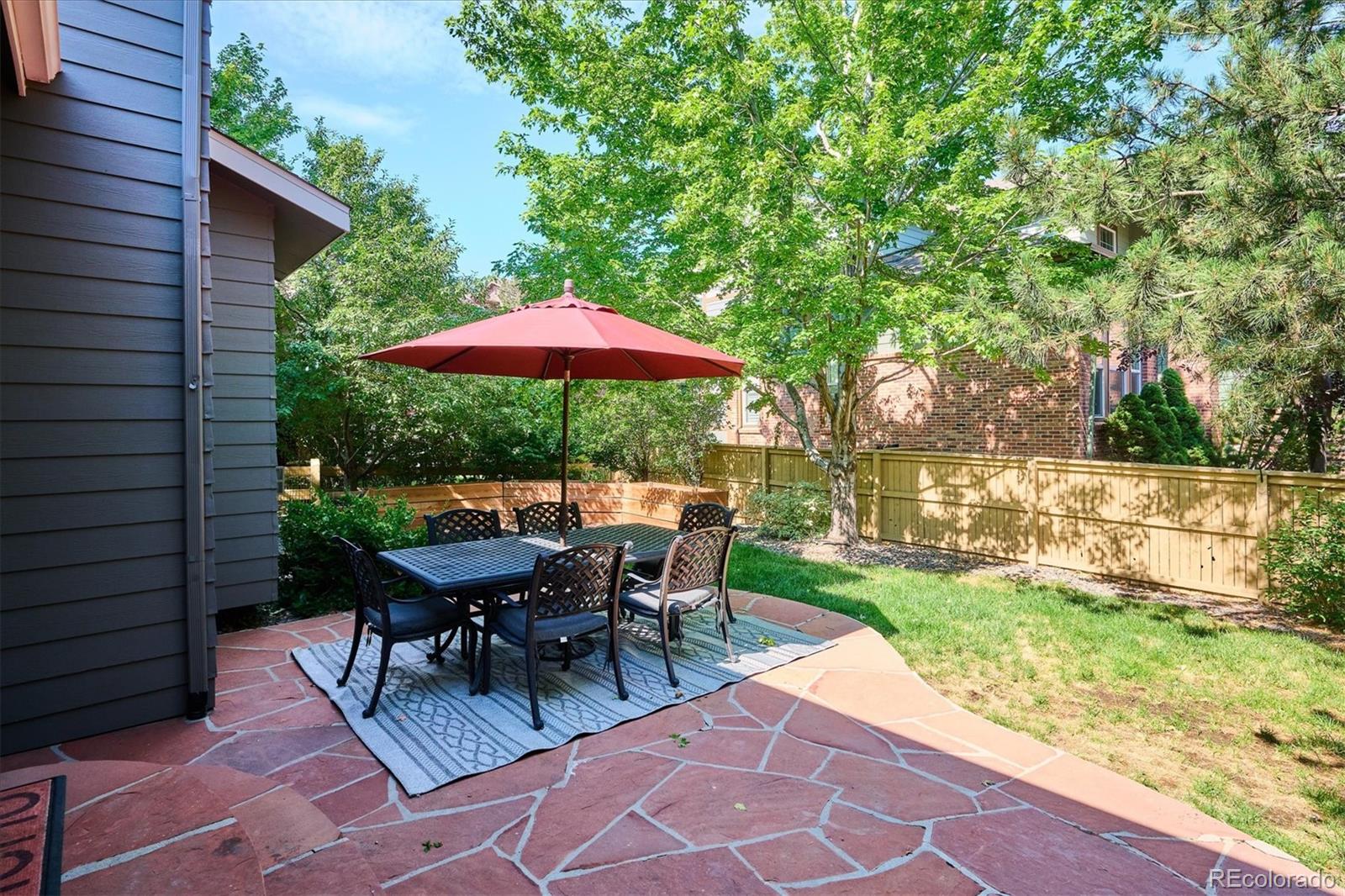3319 Lynwood Avenue Highlands Ranch, CO 80126 - Photo 37 of 46 a view of backyard with seating space and trees
