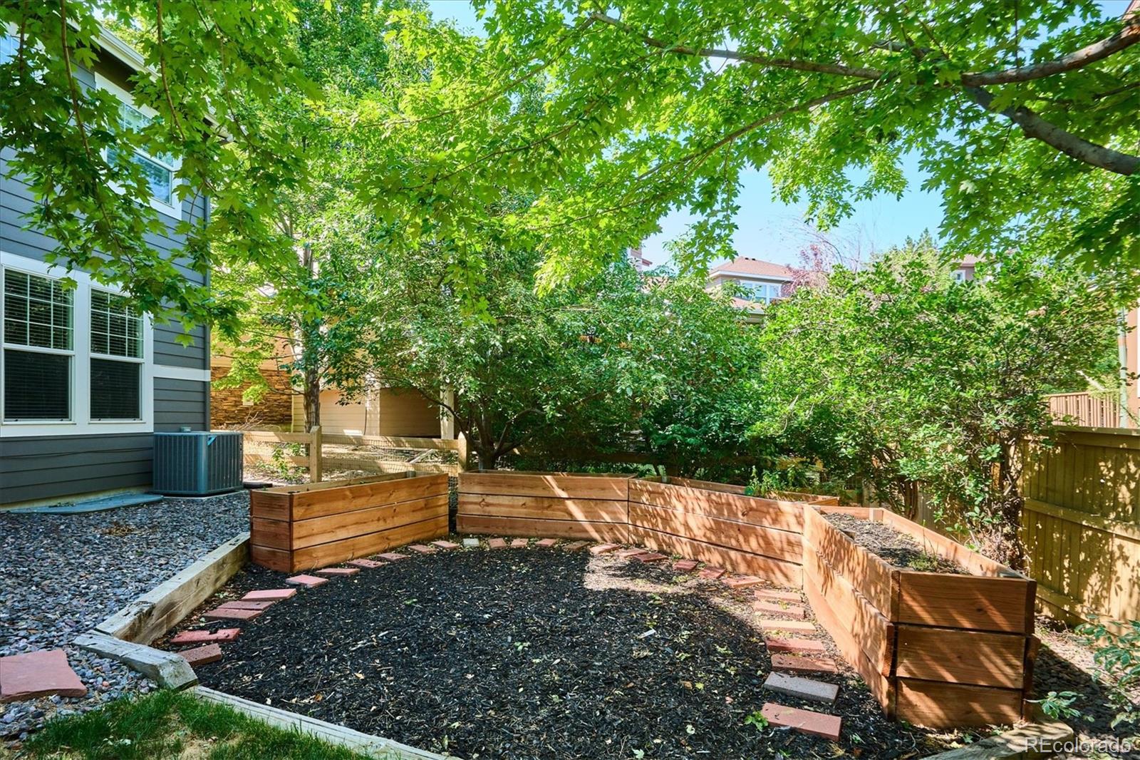 3319 Lynwood Avenue Highlands Ranch, CO 80126 - Photo 39 of 46 a view of a backyard with large trees