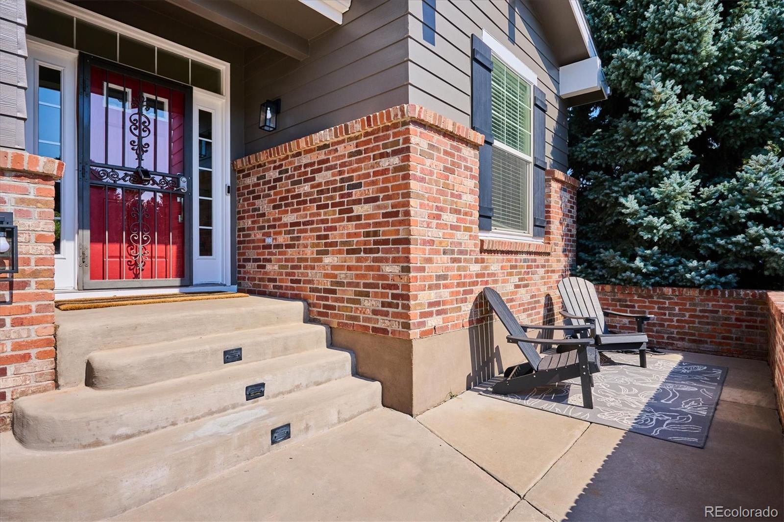3319 Lynwood Avenue Highlands Ranch, CO 80126 - Photo 42 of 46 a backyard of a house with outdoor seating