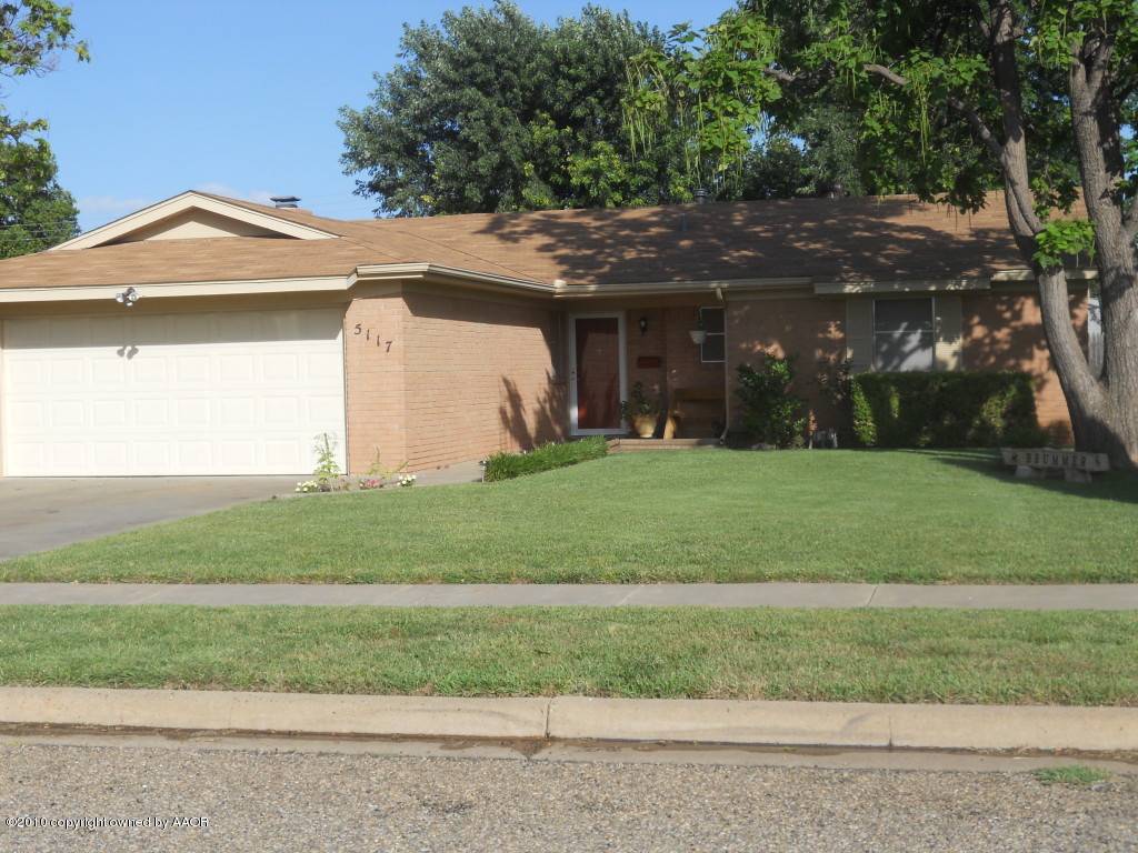 5117 McCarty Boulevard Amarillo, TX 79110 - Photo 2 of 17 a front view of a house with a yard