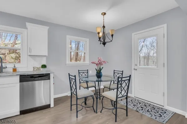 a view of a dining room and chandelier