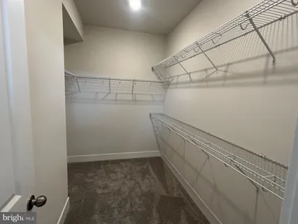 a view of a room with racks on the wall