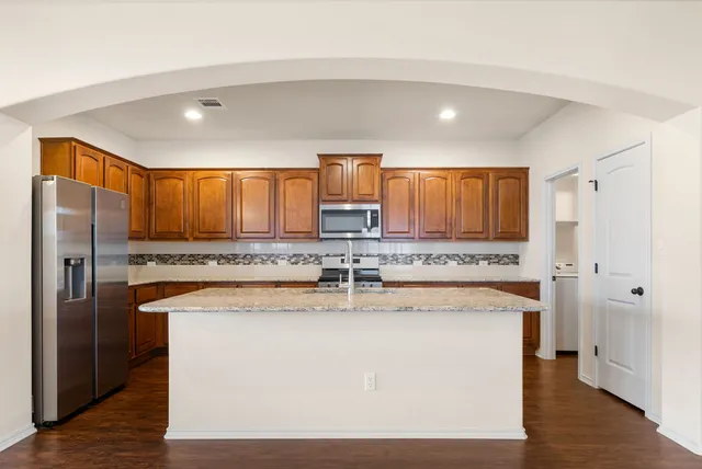 wooden floor and kitchen view