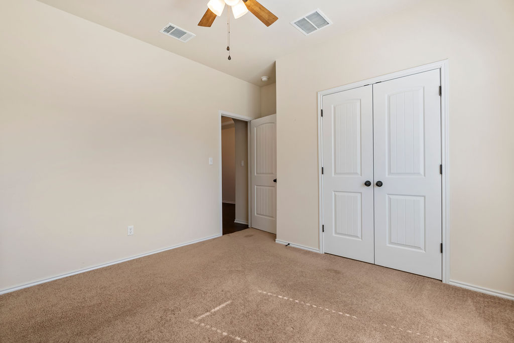 3473 Pauling Loop Round Rock, TX 78665 - Photo 18 of 33 a view of a closet and chandelier fan in a room