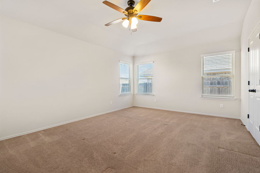 3473 Pauling Loop Round Rock, TX 78665 - Photo 23 of 33 an empty room with windows and fan