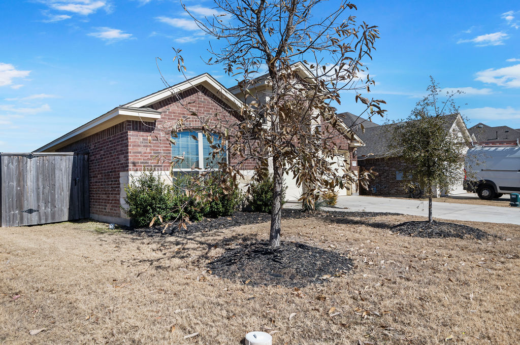 3473 Pauling Loop Round Rock, TX 78665 - Photo 3 of 33 a front view of a house with a yard