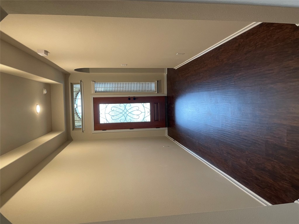 3473 Pauling Loop Round Rock, TX 78665 - Photo 4 of 26 an empty room with wooden floor and windows