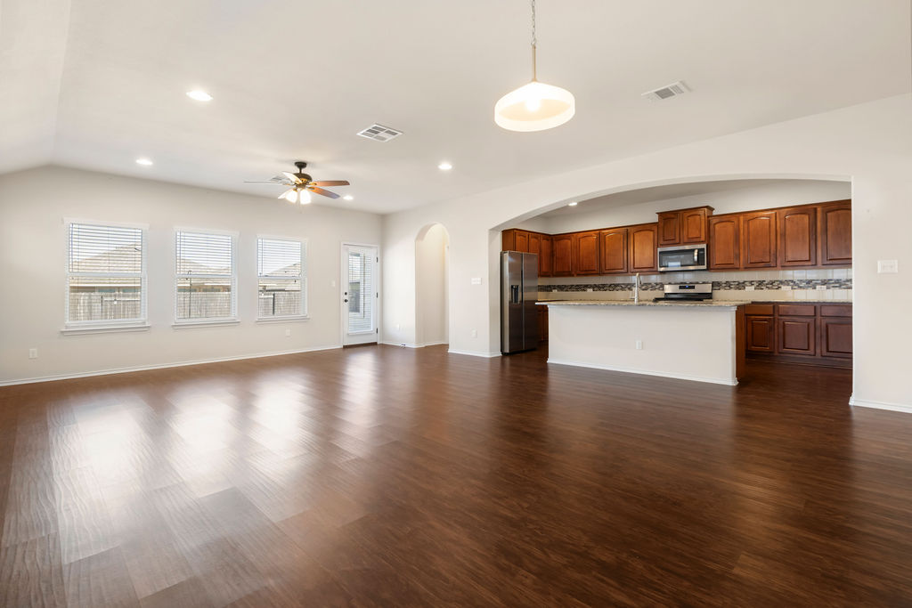 3473 Pauling Loop Round Rock, TX 78665 - Photo 32 of 33 wooden floor and kitchen view