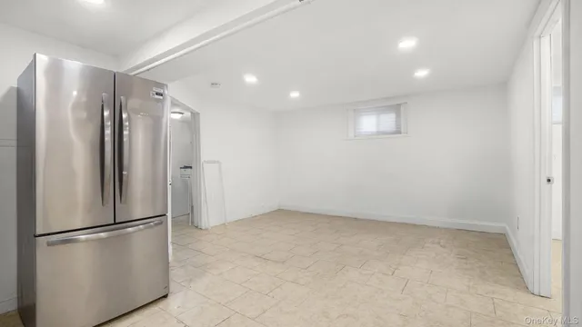 a view of a kitchen with a refrigerator and a stove