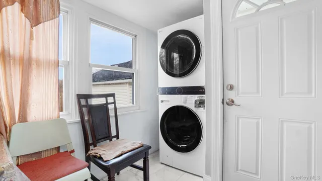 a living room with furniture and a chair