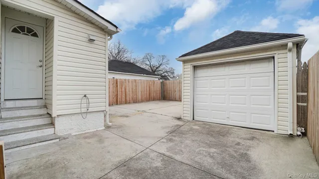 a view of garage and yard
