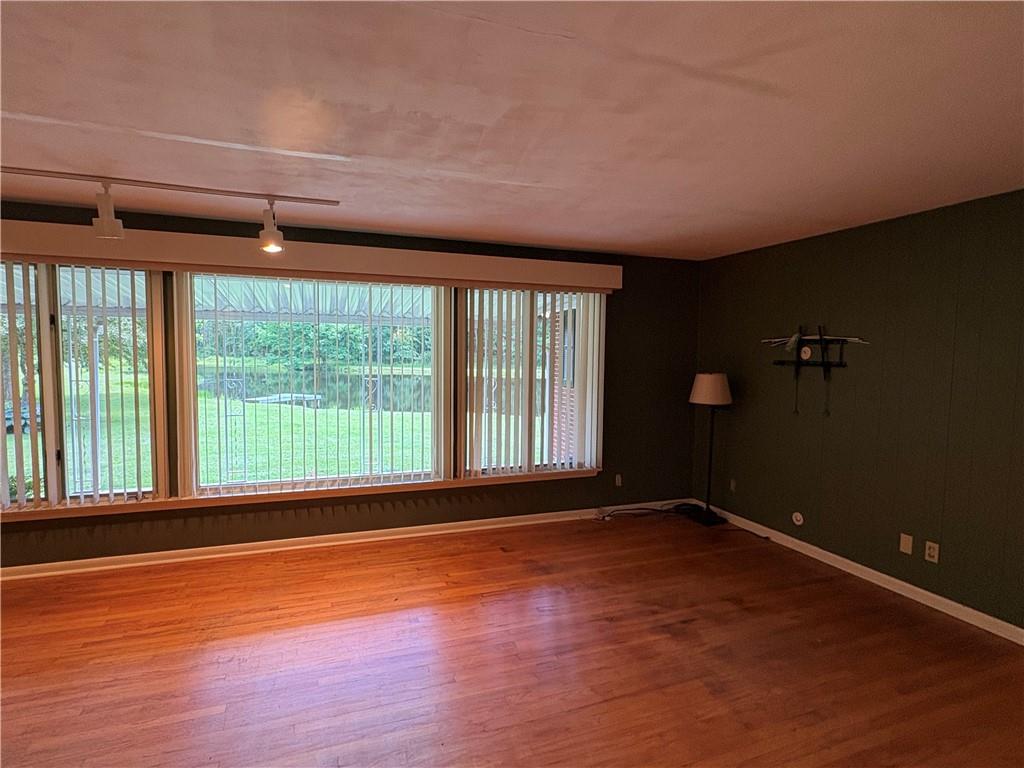 320 Cherry Hill Road Greenville, PA 16125 - Photo 8 of 38 an empty room with wooden floor and windows