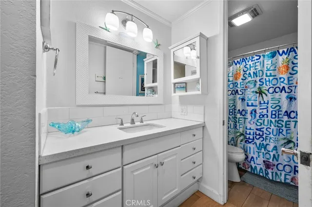 a bedroom with bed and wooden floor