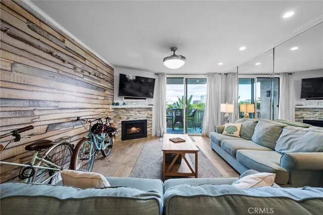 a living room with fireplace furniture and a flat screen tv