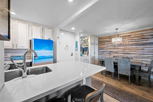 a kitchen with a table and chairs in it