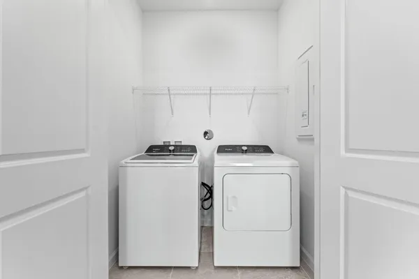 a utility room with dryer and washer