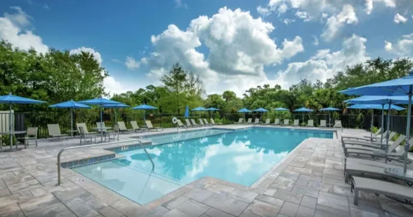 a view of a swimming pool with a patio
