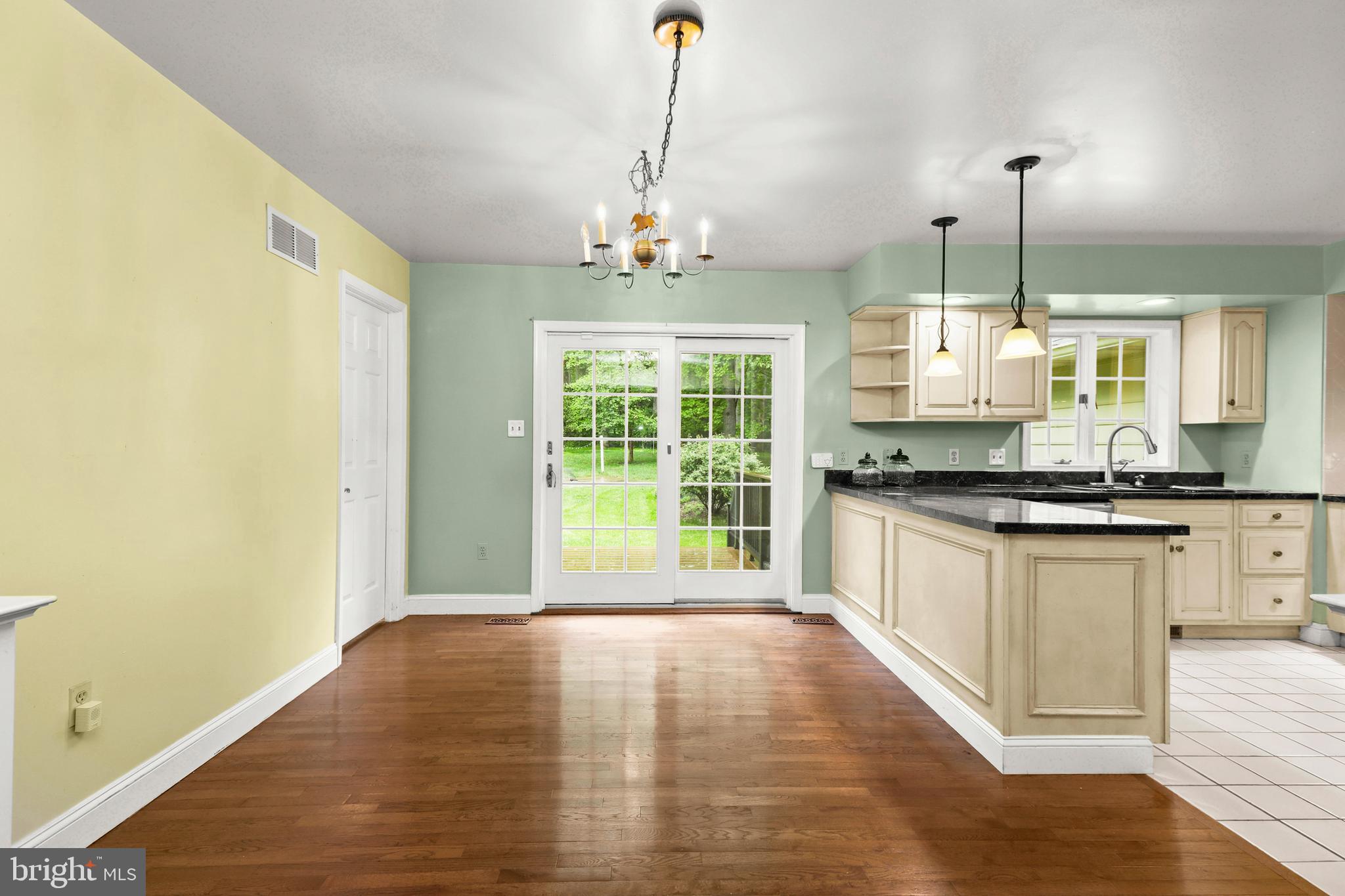 5602 Patterson Road Baldwin, MD 21013 - Photo 49 of 88 Breakfast nook with hardwood floors & chandelier