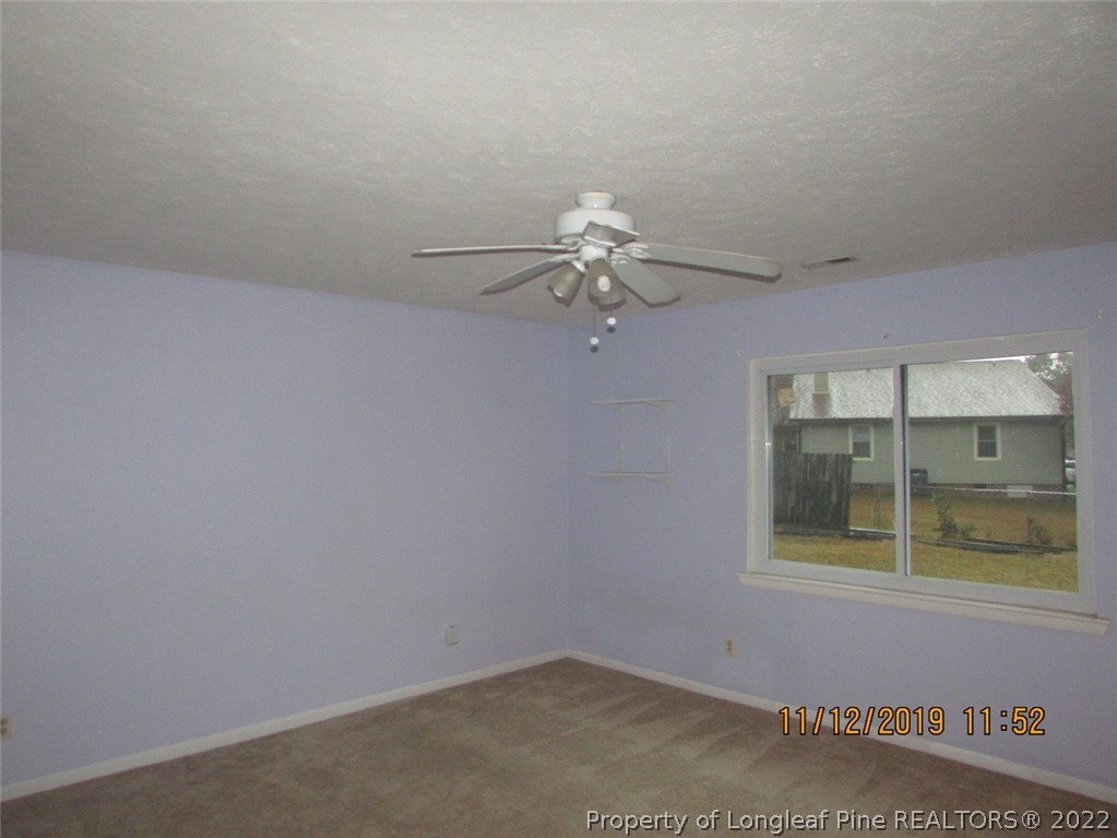 947 Rim Road Fayetteville, NC 28314 - Photo 6 of 10 an empty room with a window
