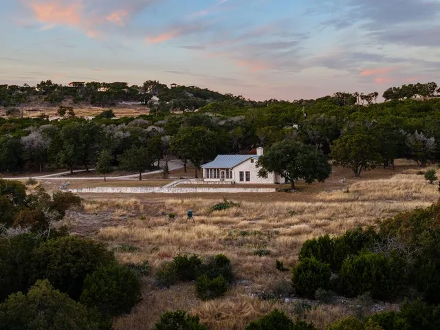 a view of a town with mountains in the background