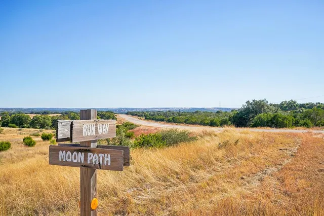 a view of a table and chairs in the patio