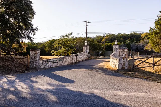 a view of a yard covered with snow in front of house