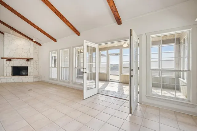 a view of a hallway with windows