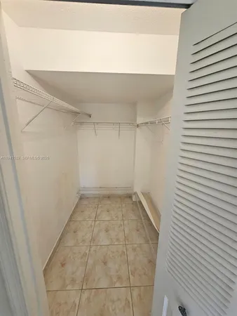 a view of a room with white walls