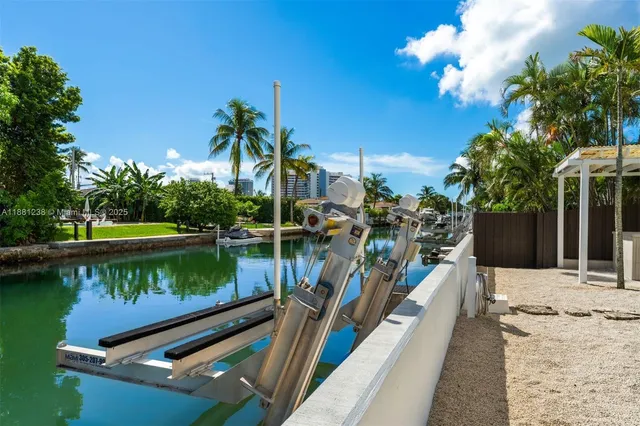 a view of a lake with a house in the background