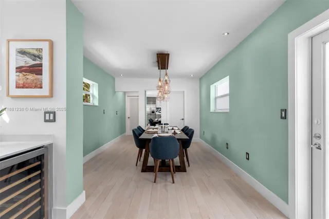 a dining room with a table and chairs