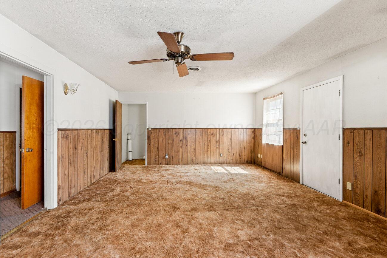 4305 South Bonham Street Amarillo, TX 79110 - Photo 6 of 48 an empty room with closet and windows