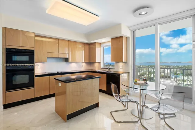 a spacious bedroom with a large bed and a large window