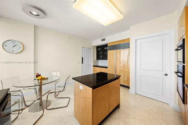 a bed room with a bed and a large window