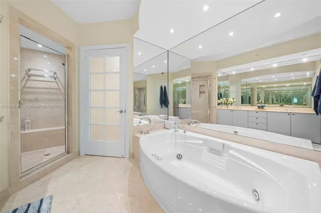 a spacious bedroom with two beds and a large window