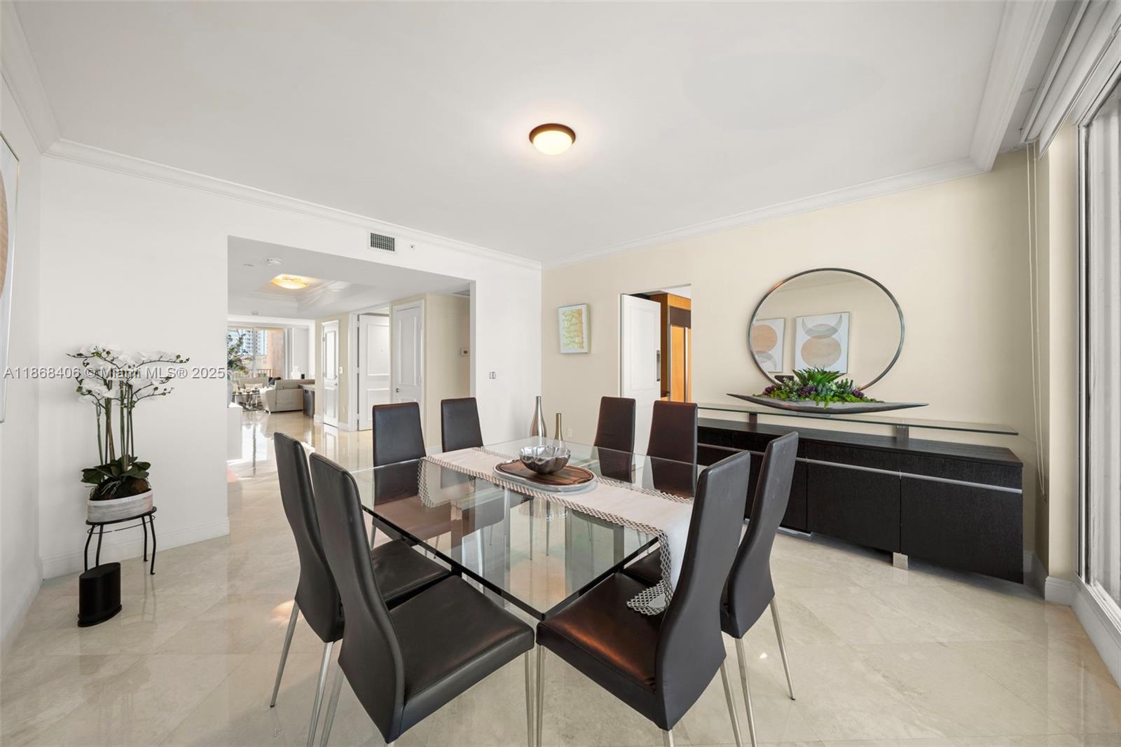 781 Crandon Boulevard, Unit 1802 Key Biscayne, FL 33149 - Photo 10 of 59 a view of a dining room with furniture and window