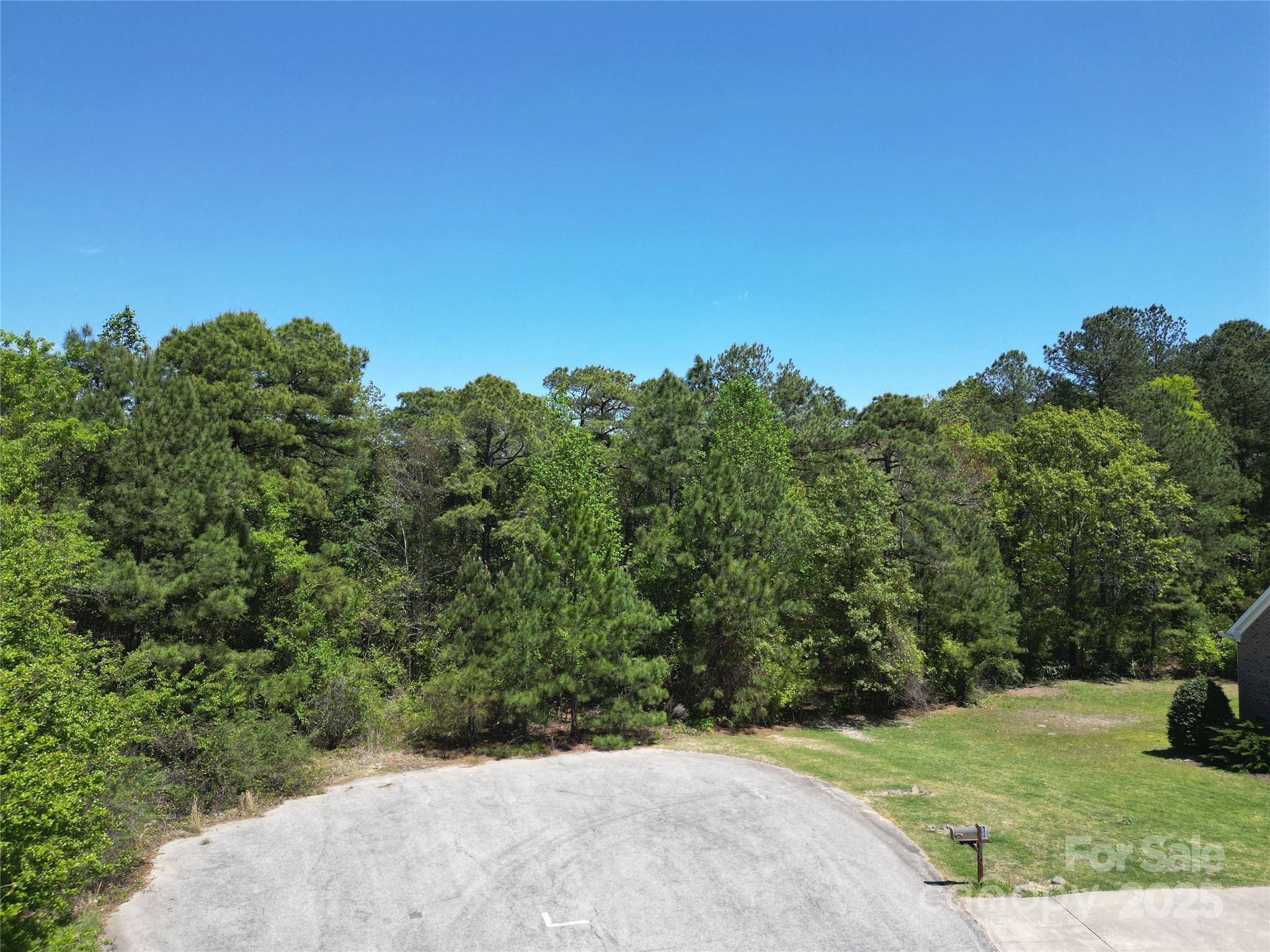 Tbd Queens Cove Way Carthage, NC 28327 - Photo 12 of 33 a view of a yard with a tree