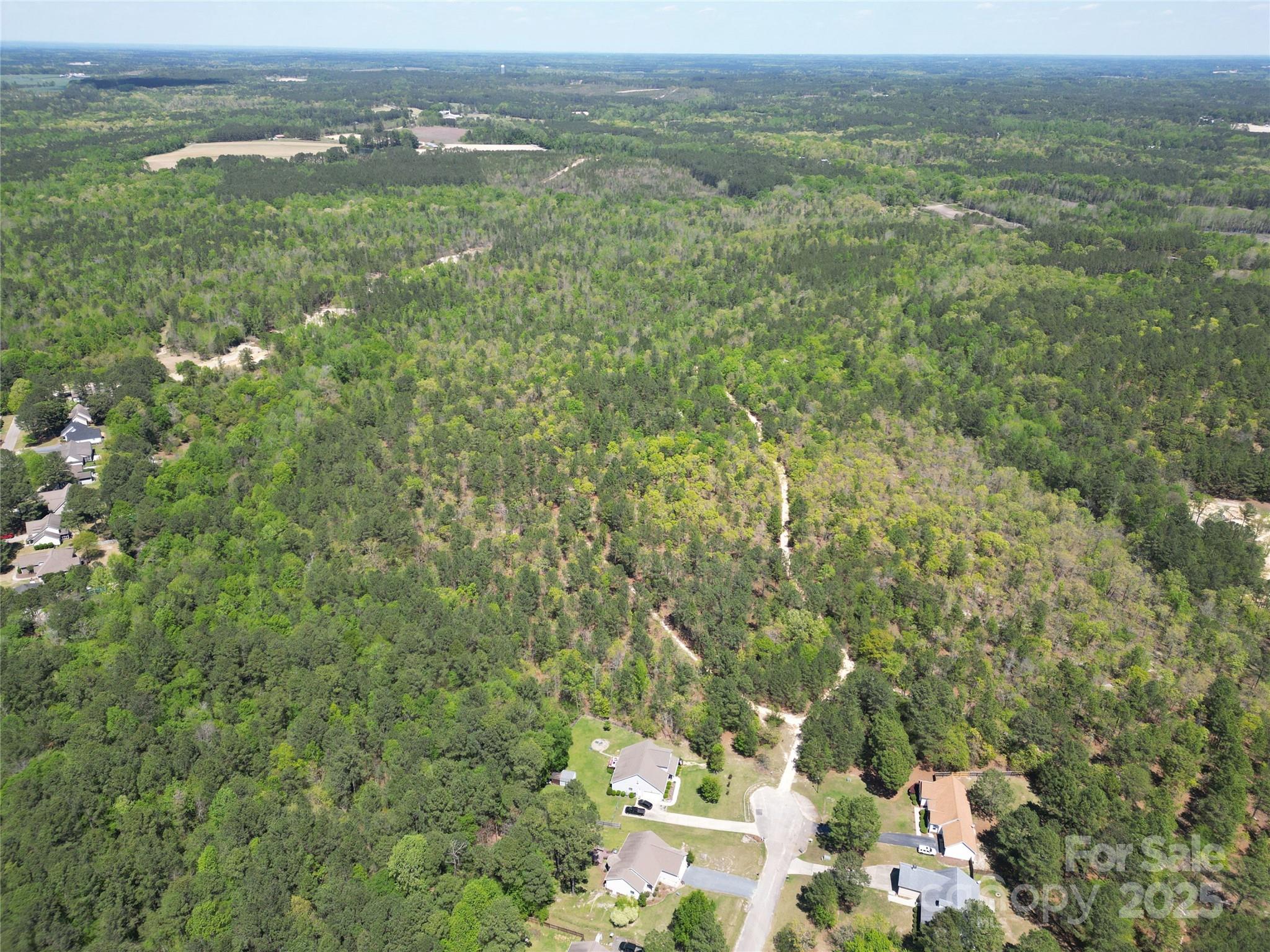 Tbd Queens Cove Way Carthage, NC 28327 - Photo 25 of 33 a view of a city with lush green forest and mountain view