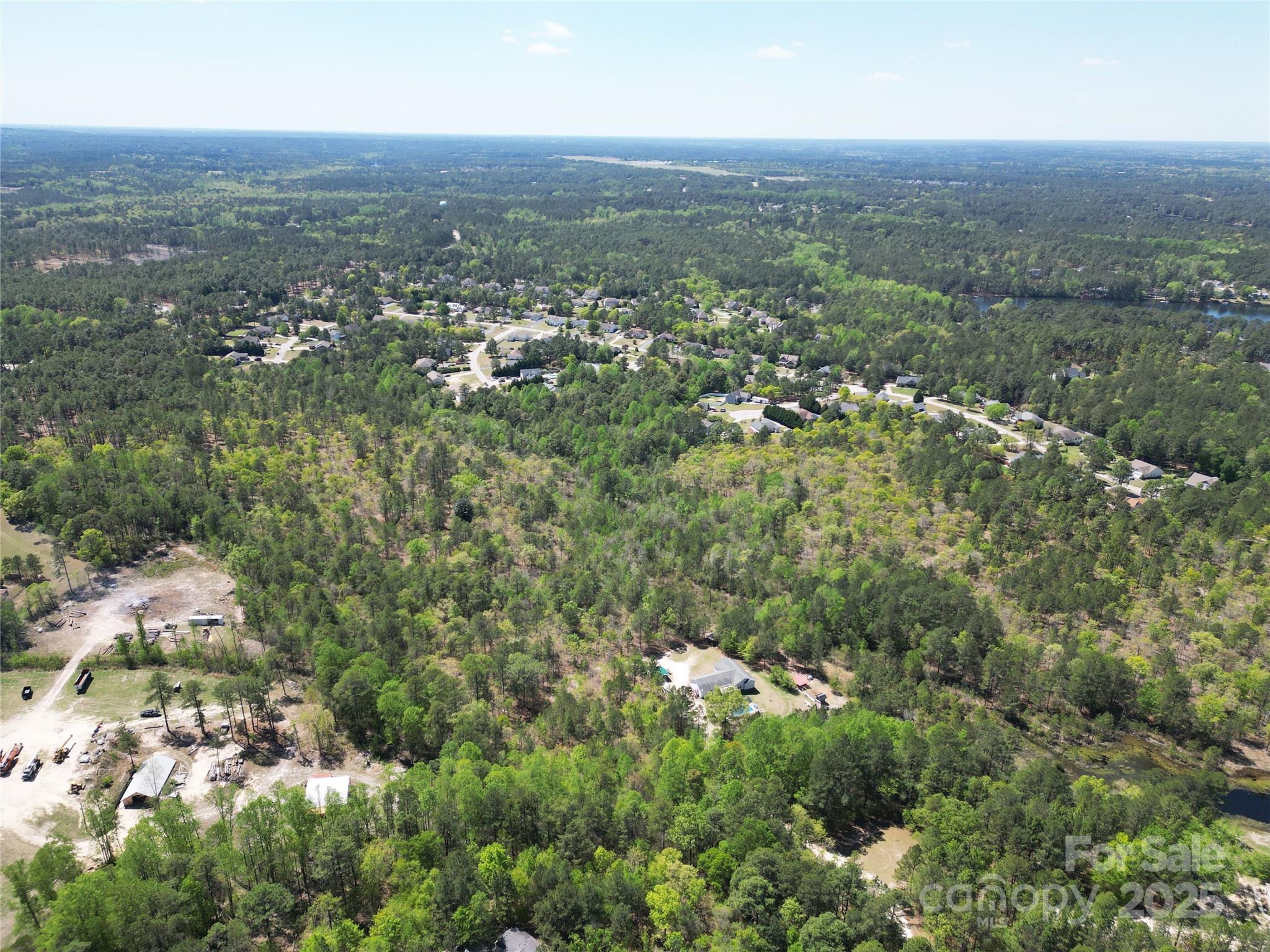 Tbd Queens Cove Way Carthage, NC 28327 - Photo 27 of 33 an aerial view of residential houses with outdoor space and trees