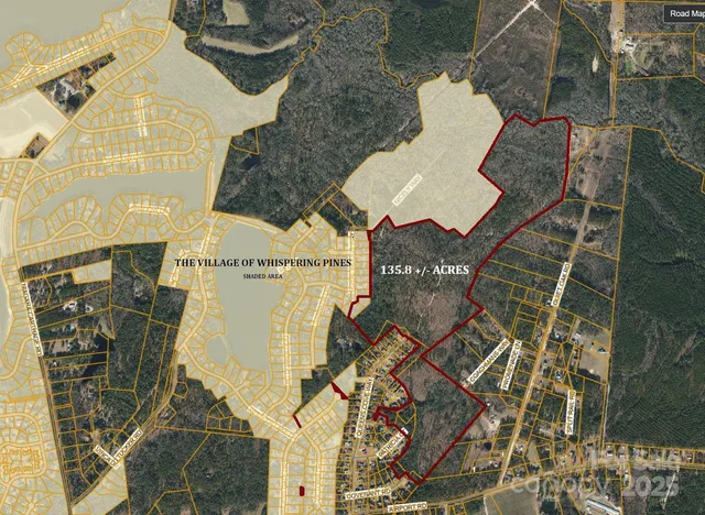 a view of outdoor space with swimming pool and trees in the background