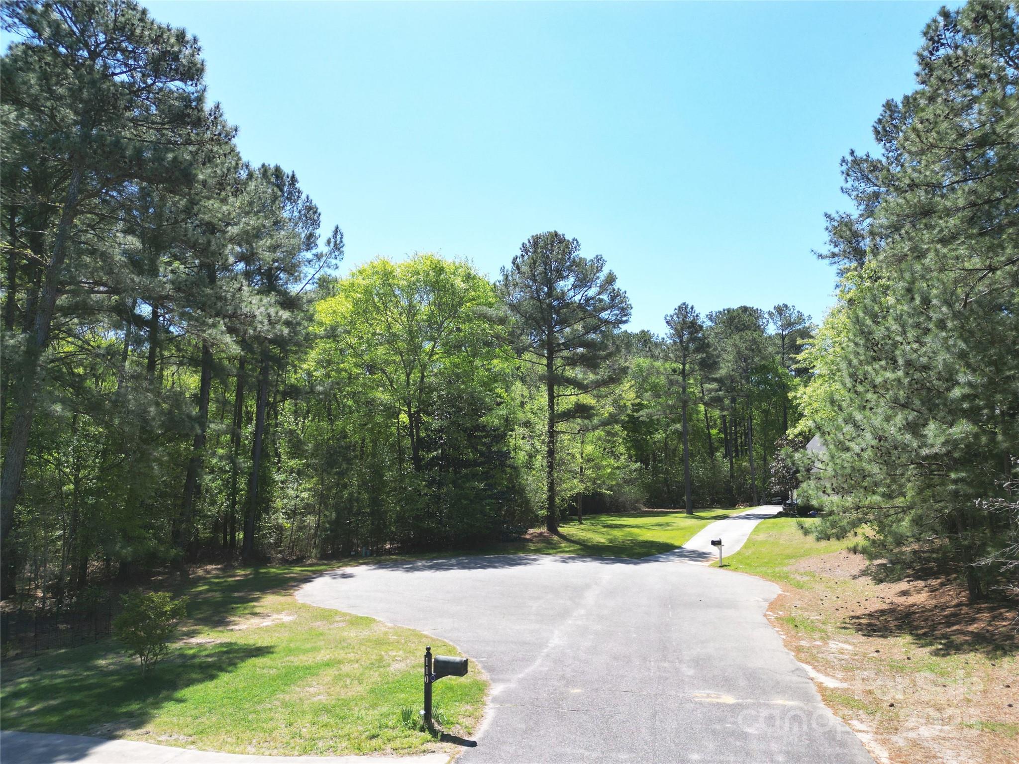Tbd Queens Cove Way Carthage, NC 28327 - Photo 5 of 33 a view of a yard with plants and large trees